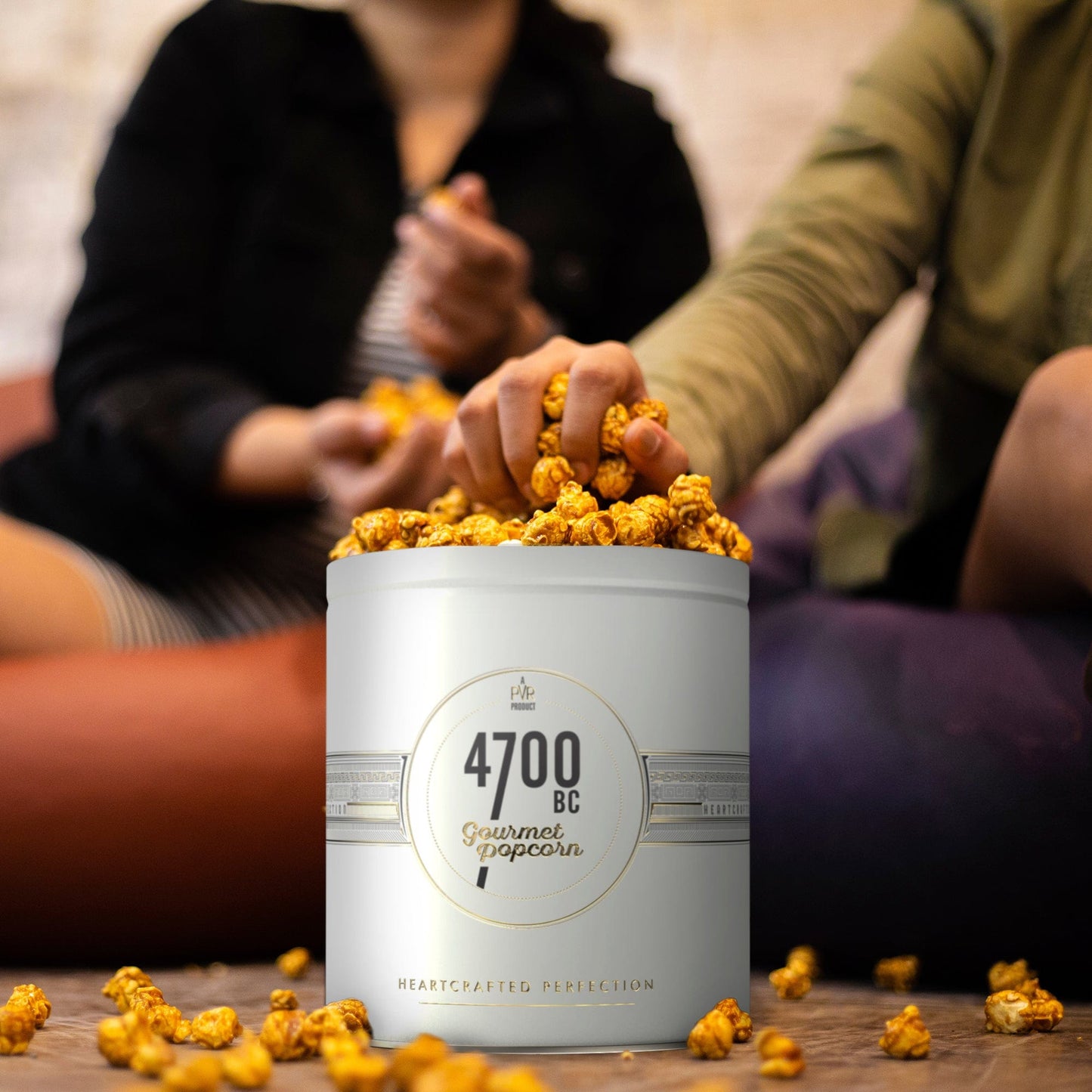 Enjoying a handful of 4700bc cheese gourmet popcorn with friends