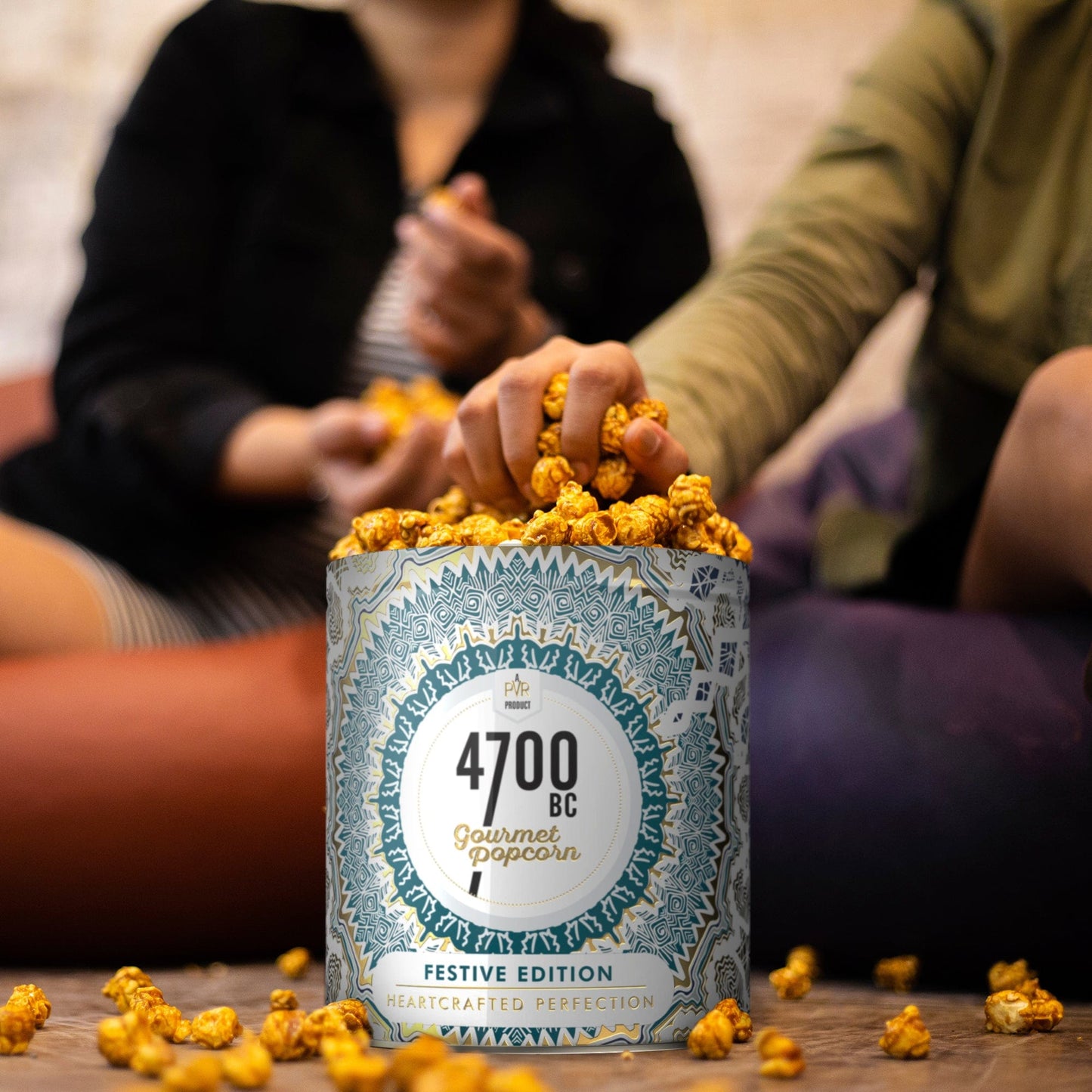 Enjoying a handful of 4700bc chocolate gourmet popcorn with friends